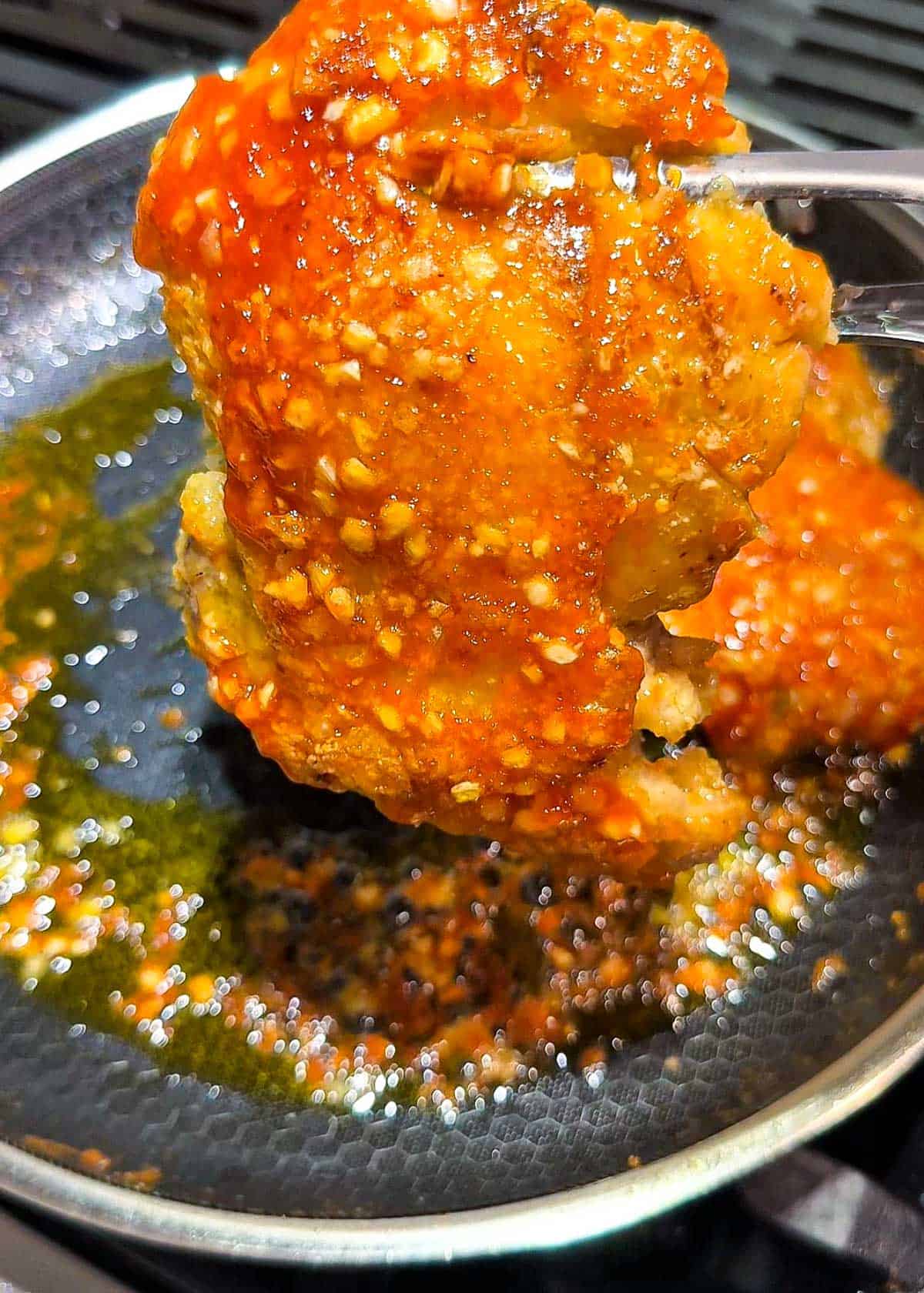 crispy chicken thigh pieces tossed in sticky spicy garlic sauce