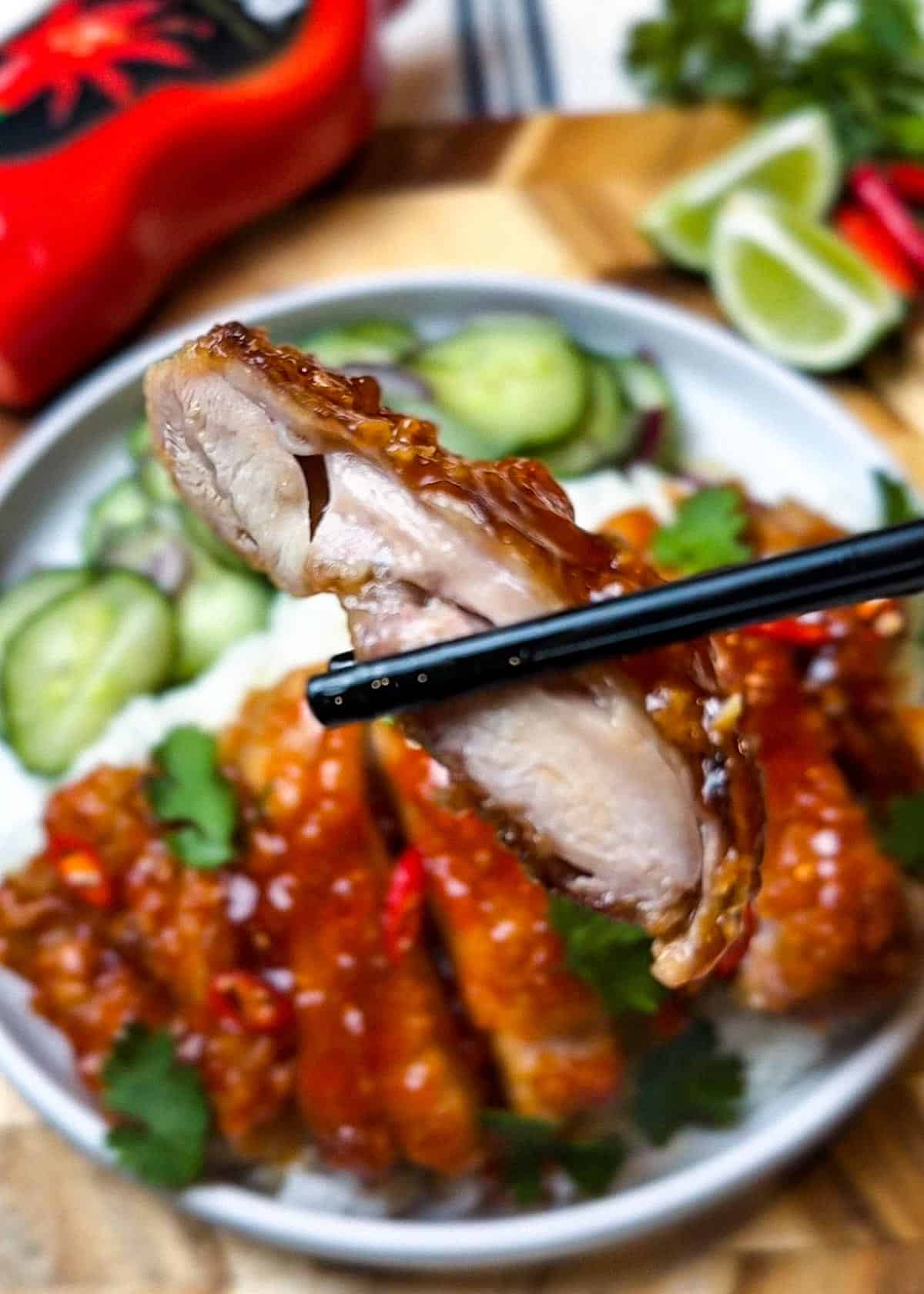 close up of golden lava chicken thigh recipe served over rice