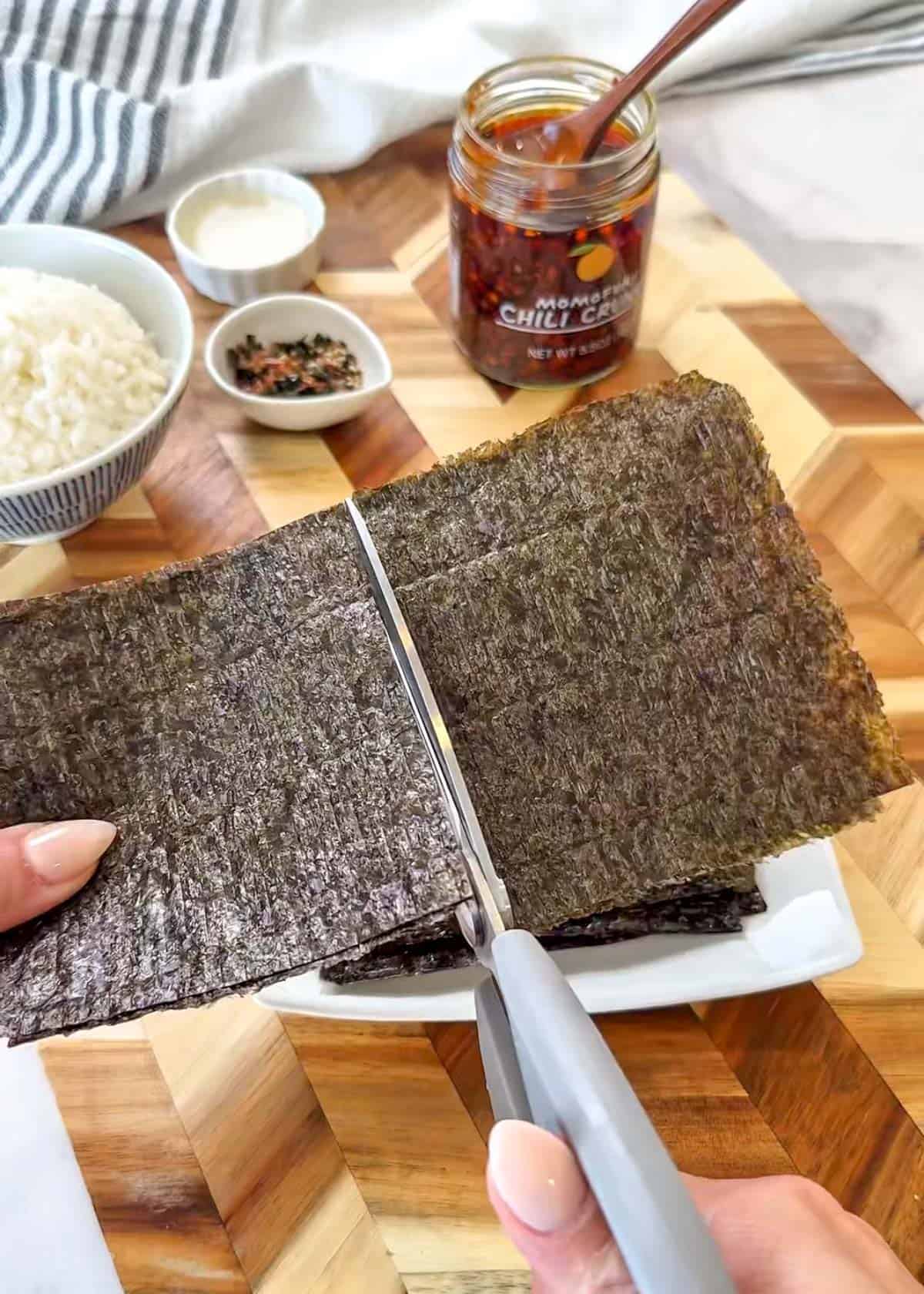 cutting seaweed paper with scissors