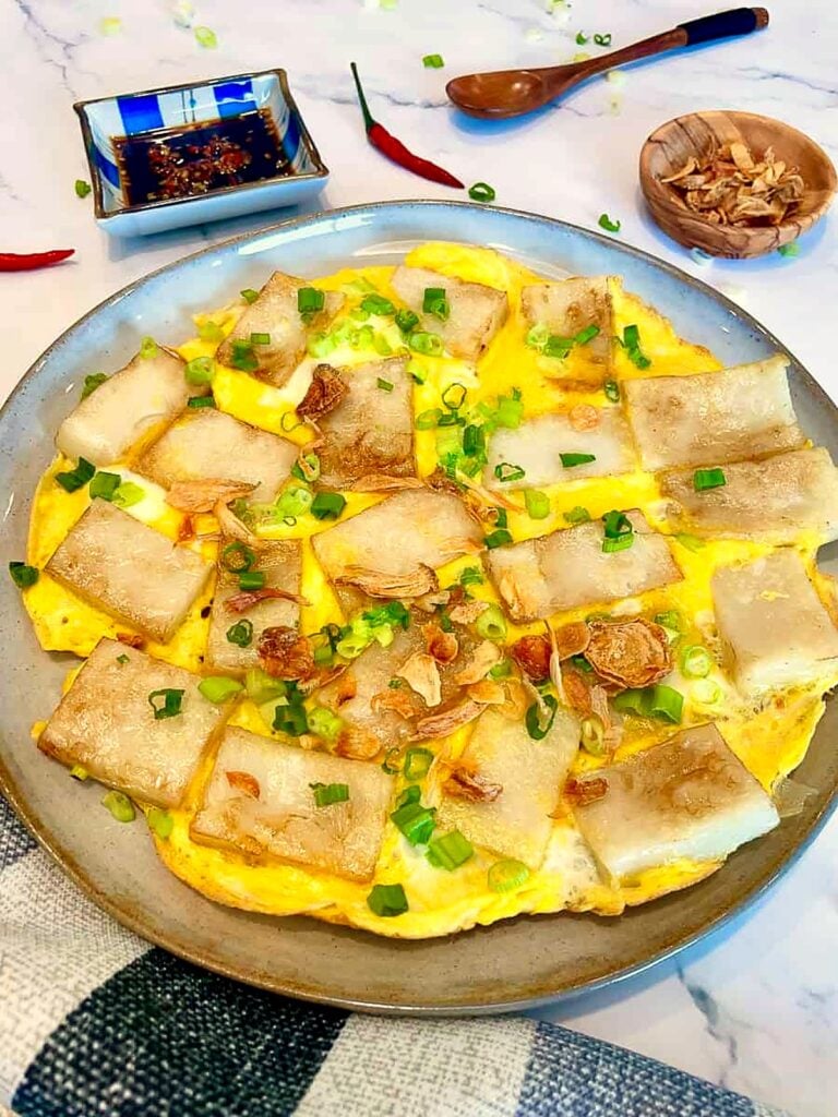 Bánh bột chiên, crispy Vietnamese fried rice cakes with egg and green onions, served with dipping sauce