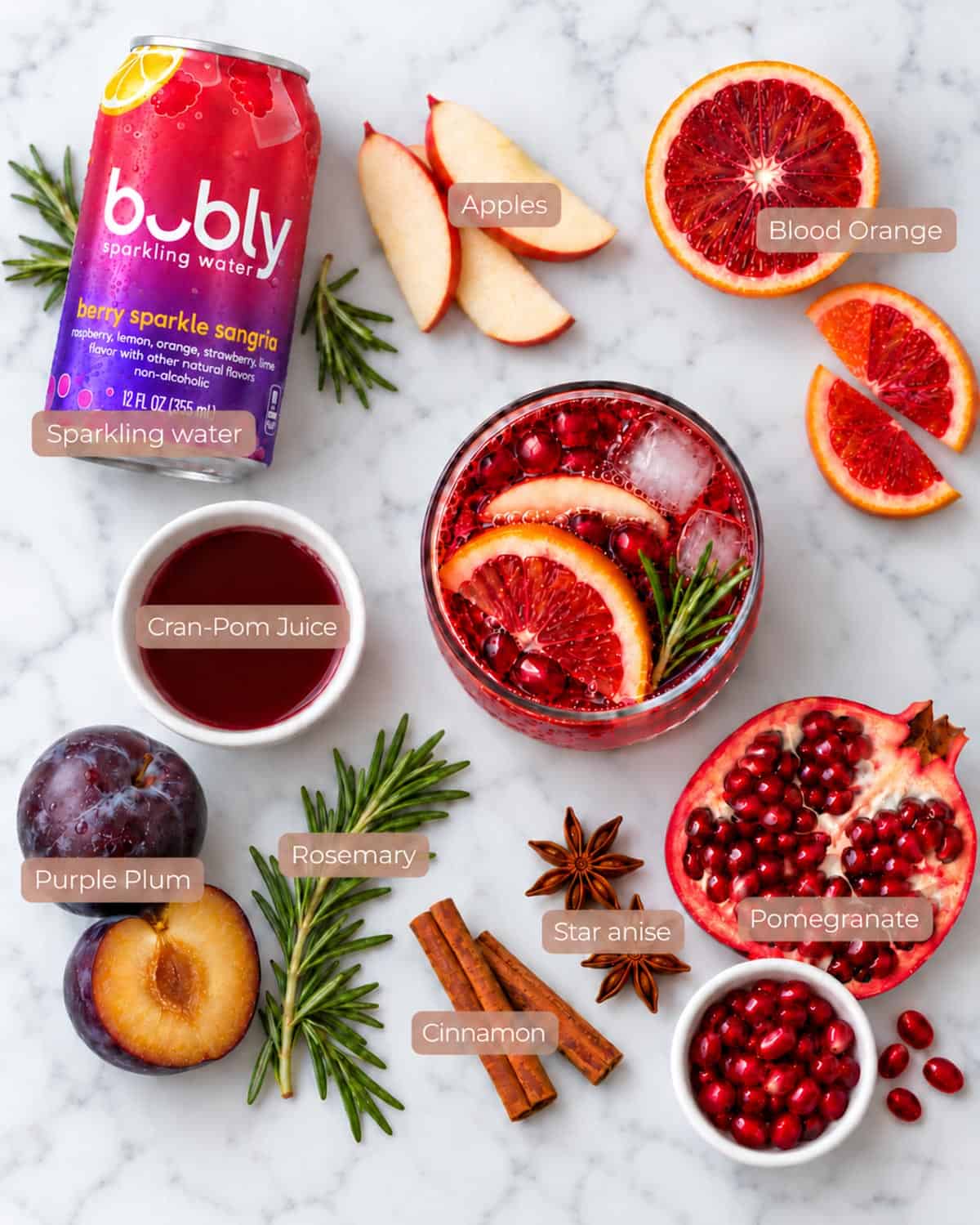 Sangria without wine ingredients with blood oranges, apple, and pomegranate
